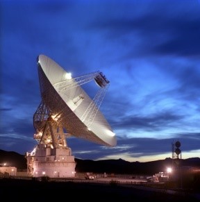 Image of a radar dish pointing at the night sky