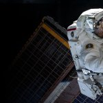 An astronaut performing a spacewalk outside the International Space Station