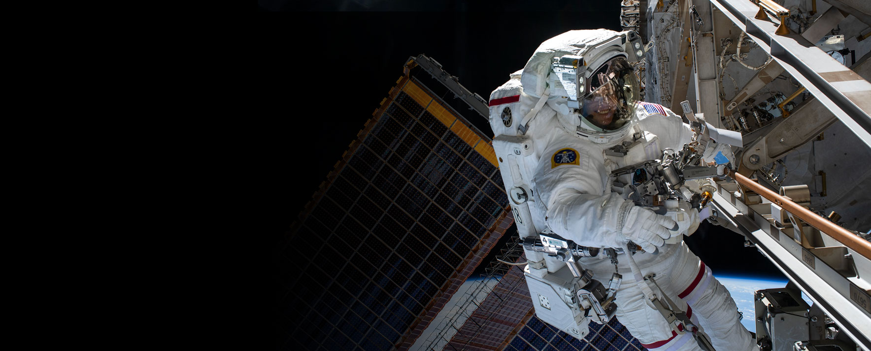 An astronaut performing a spacewalk outside the International Space Station