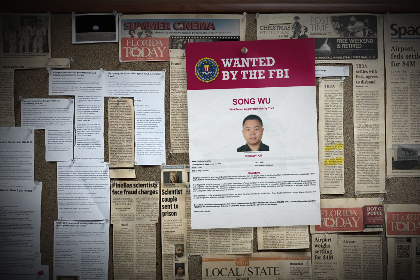 An "FBI Wanted" poster with Song Wu's image tacked to a cork board with newspaper clippings about other investigations by NASA OIG