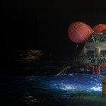 The Orion spacecraft floating in the Pacific Ocean after splashdown.