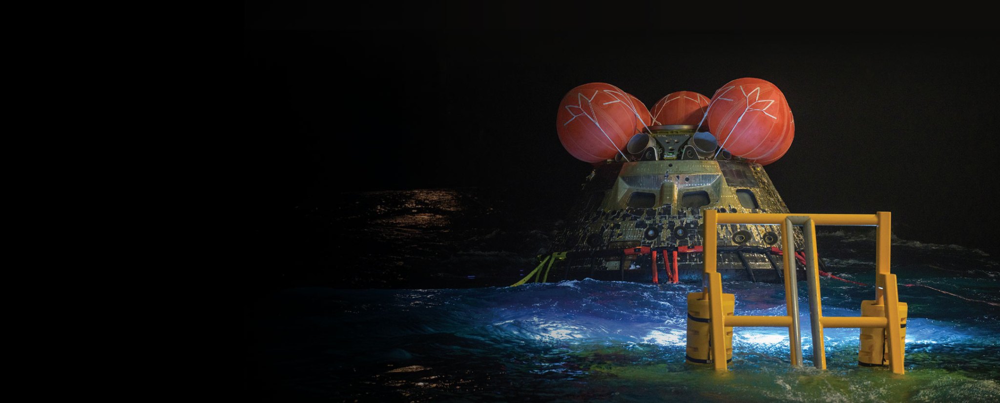The Orion spacecraft floating in the Pacific Ocean after splashdown.