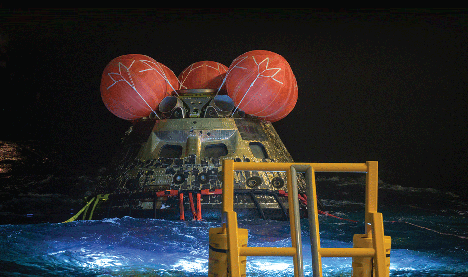 The Orion spacecraft floating in the Pacific Ocean after splashdown.