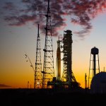 NASA’s Space Launch System rocket and Orion spacecraft on a launch pad at sunset