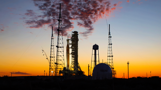 NASA’s Space Launch System rocket and Orion spacecraft on a launch pad at sunset